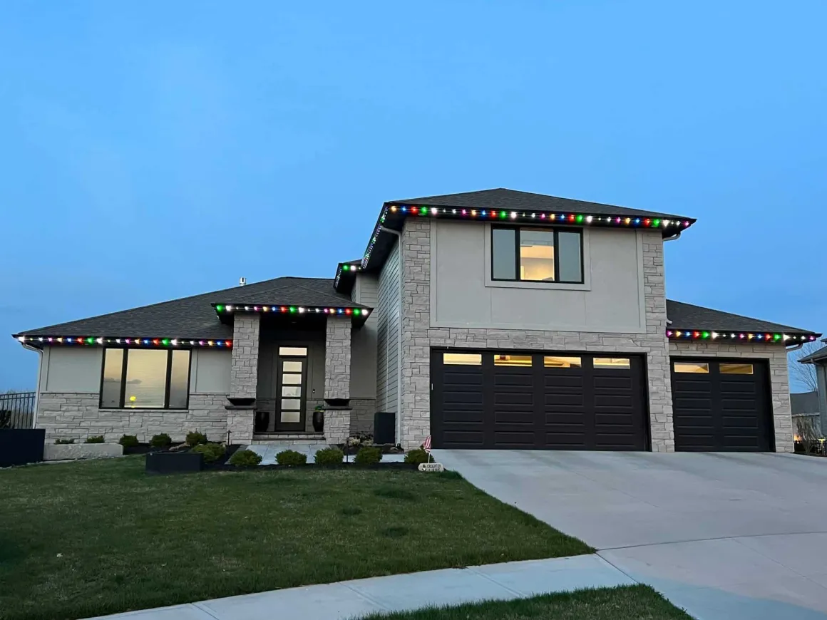 Holiday color lighting on a Denver home roofline