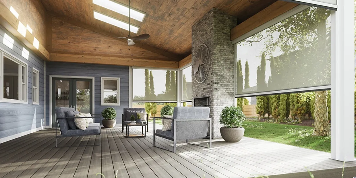 Bright covered outdoor living room overlooking a sunny Denver backyard